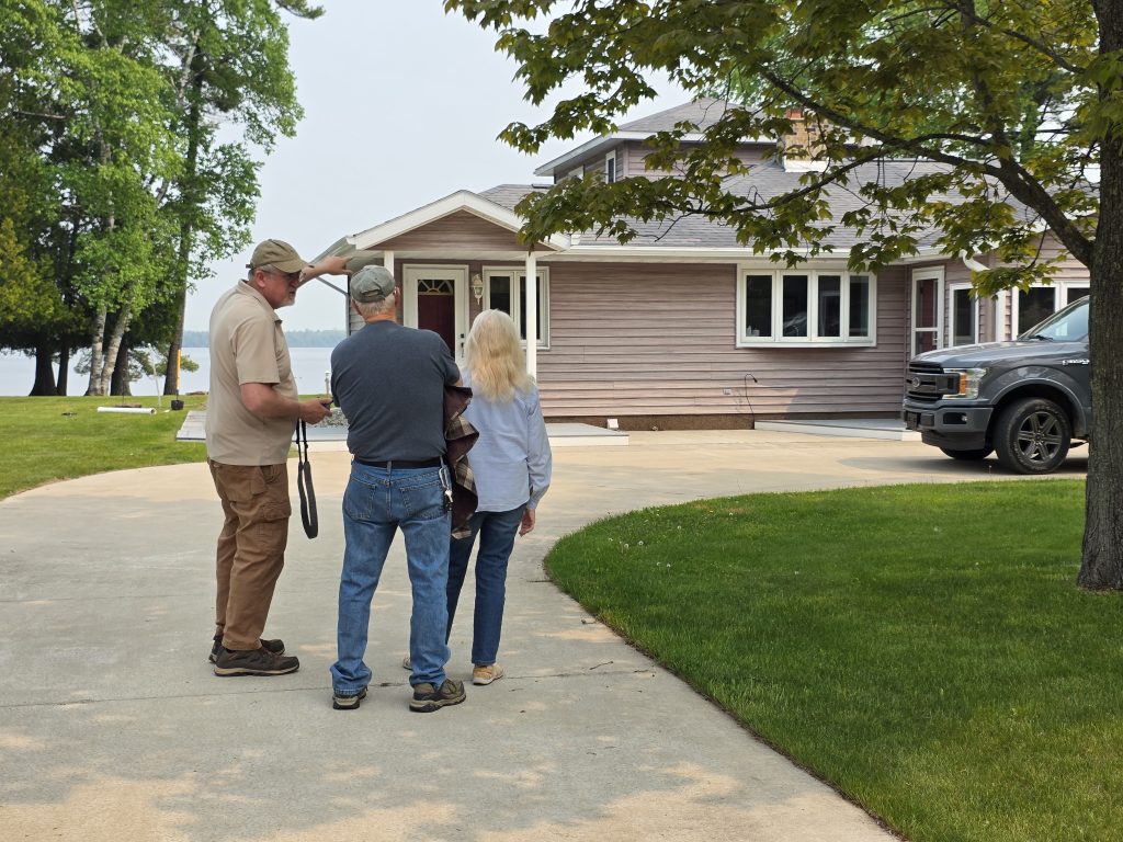 Master home inspector Rich Beasley consults with clients near Manistique, MI